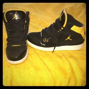 black and yellow flight jordans